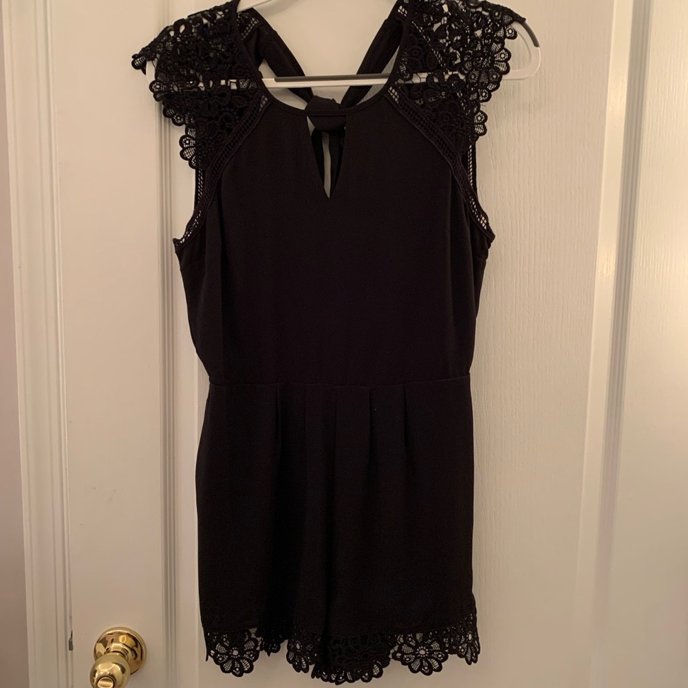 Elegant express black romper for sale, worn only several times in a size 6